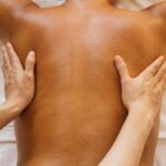 A serene back massage session promoting relaxation and wellness in a spa environment.